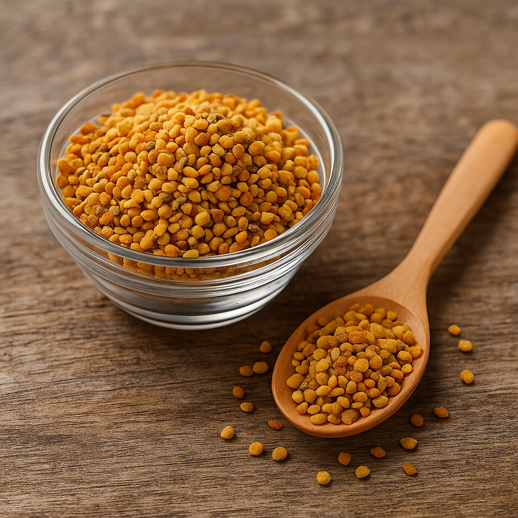 A high-resolution digital photograph showcases golden bee pollen granules in a clear glass bowl, placed beside a wooden spoon filled with pollen, all resting on a rustic wooden surface.