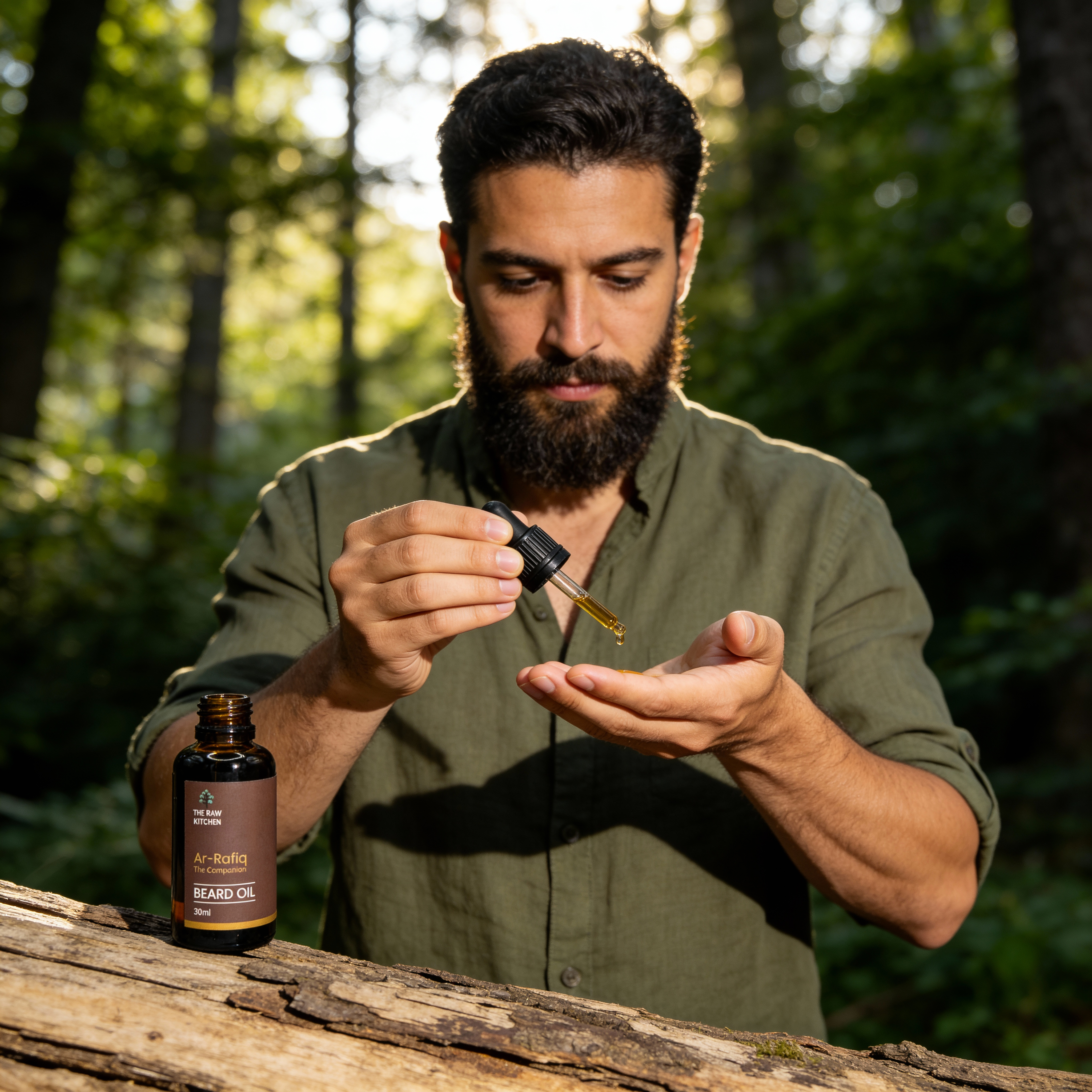 Man applying beard oil outdoors in a forest setting