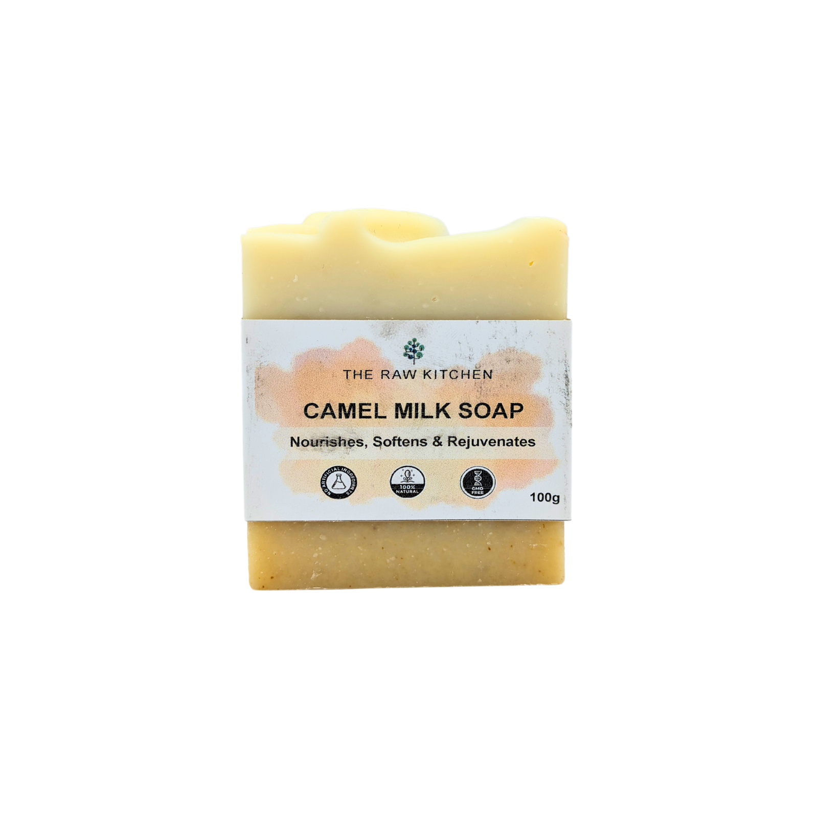 A 100g bar of Camel Milk Soap with its branded paper wrapper from The Raw Kitchen UK.