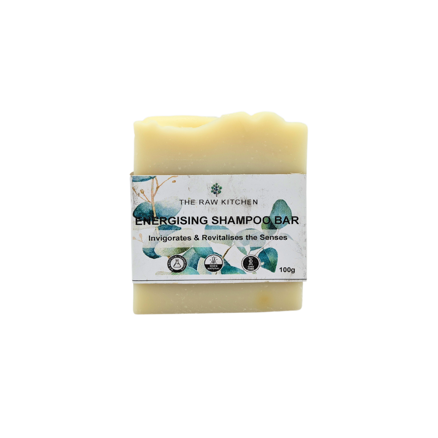 A 100g bar of Energising Shampoo Bar with its branded paper wrapper from The Raw Kitchen UK.
