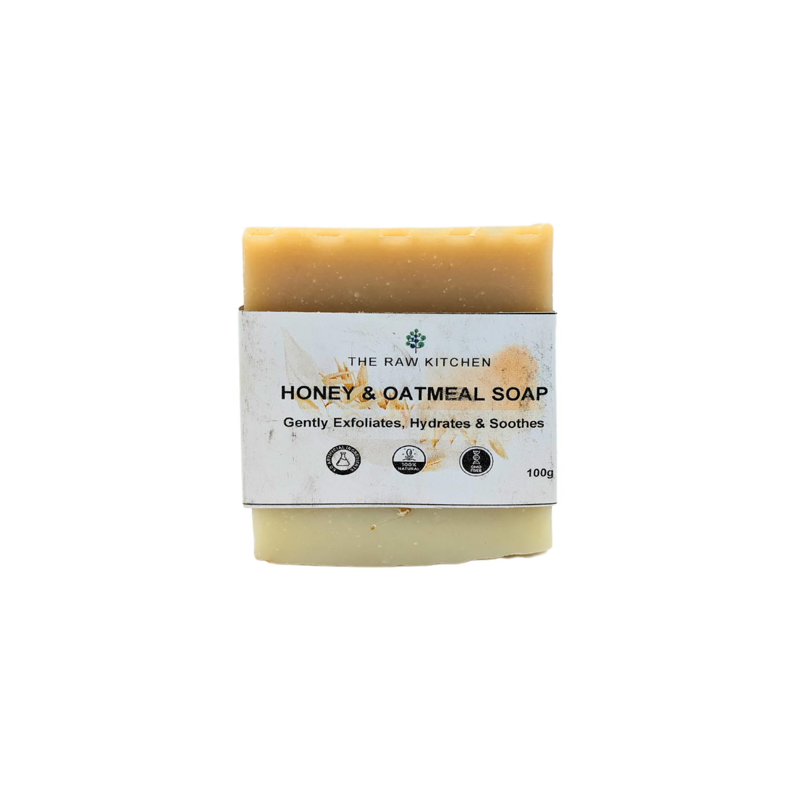 A 100g bar of Honey & Oat Soap with its branded paper wrapper from The Raw Kitchen UK.