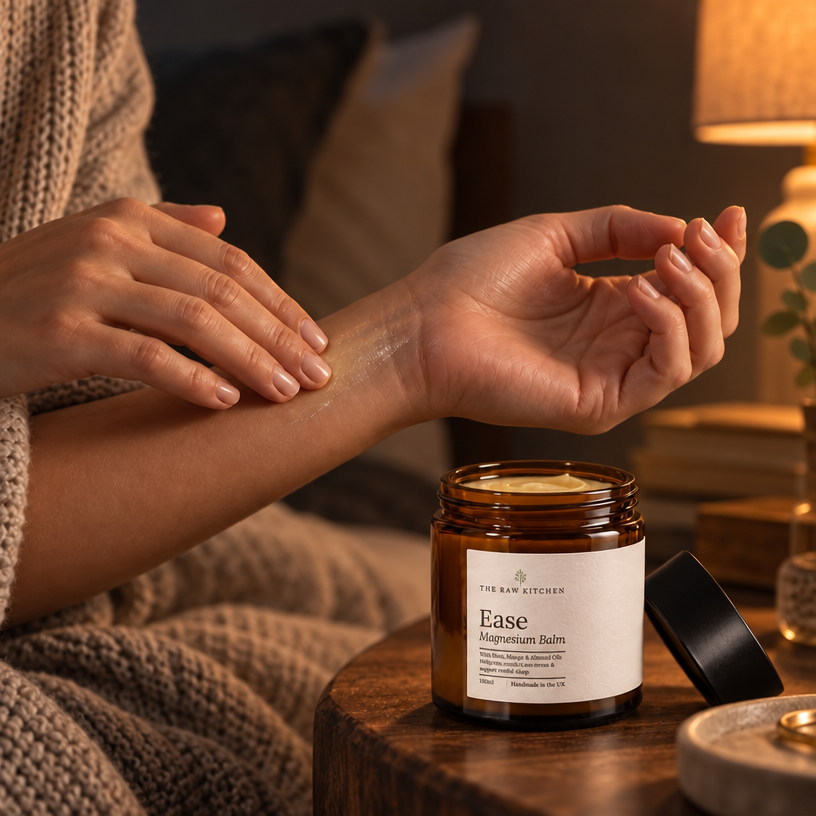 Magnesium balm jar beside hands applying cream on forearm