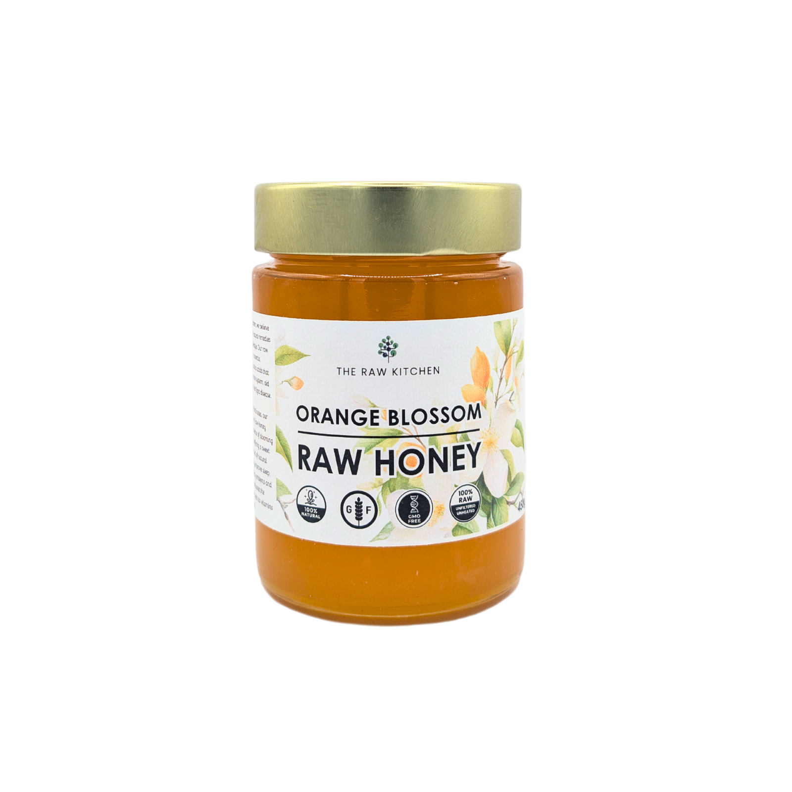 A 450g glass jar of Orange Blossom Raw Honey with a gold lid and branded label - The Raw Kitchen UK.