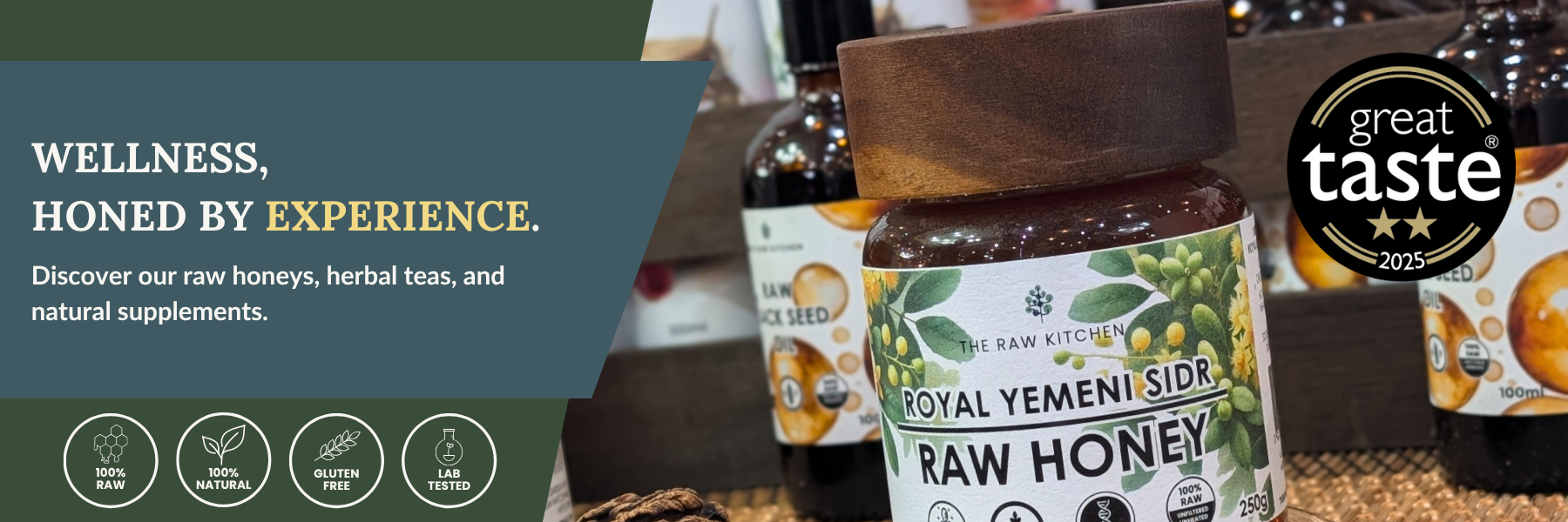 Jars of raw honey with 'Great Taste' award label on a wooden surface.