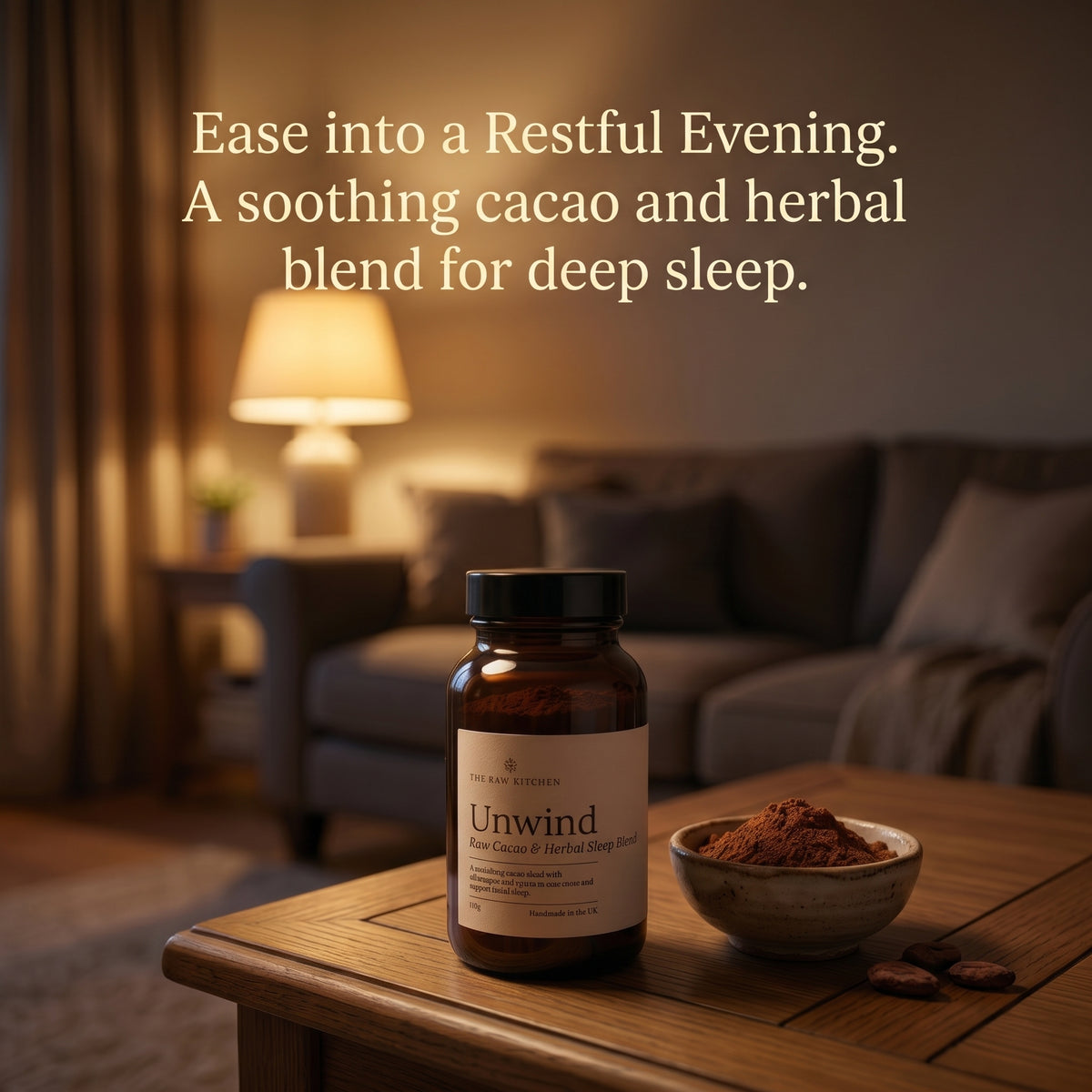 A bottle of Unwind herbal sleep supplement and a small bowl of cacao powder sit on a wooden table in a cozy living room setting, with warm text overlay at the top.